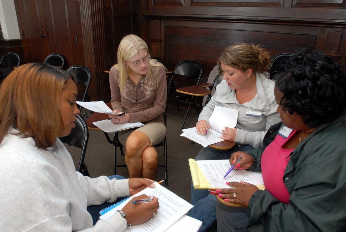 The national seminar on &quot;Keeping the Meaning in Mathematics: The Craft of Word Problems,&quot; July 2007. (Left to right: National Fellows Tanya Shannon, Atlanta; Paula Shaffer-Roche, Pittsburgh; Jill Elizabeth Smith, Charlotte; and Angel Johnson, Chicago.)