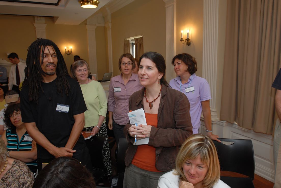 Opening Meeting at the Intensive Session, July 2007. (Standing, left to right: National Fellow Ram Bhagat; Alexina R. Fagan, Writing Instructor, Virginia Commonwealth University; and National Fellows Emily Betts, Clary W. Carleton, and Valerie Schwarz, all of Richmond.)