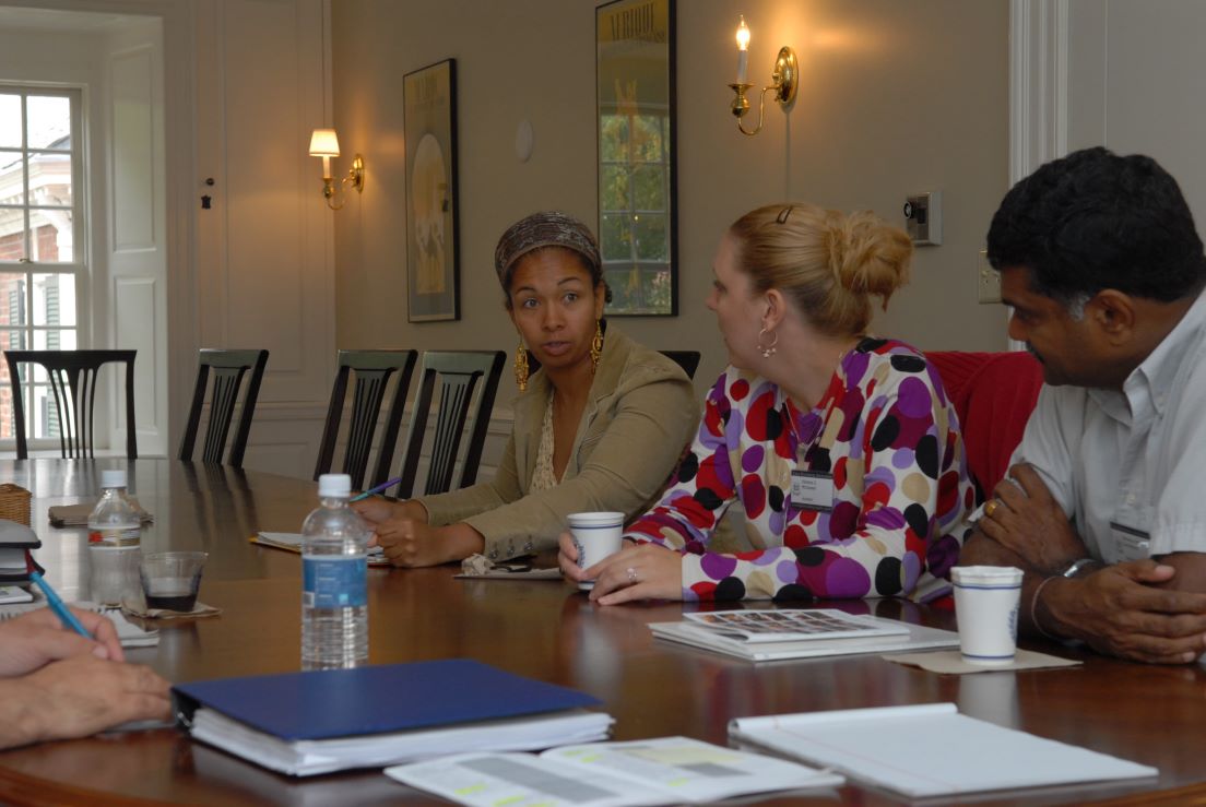 Houston Team meeting at the Intensive Session, July 2006. (Left to right: National Fellows Michea R. Carter, and Karlene E. McGowen; and Gemunu Heart Gunaratne, Professor of Physics, University of Houston.)