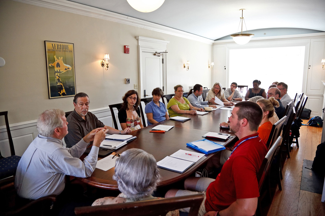 National Leadership meeting at the Intensive Session, July 2010. (Clockwise from bottom right: James R. Vivian, director of the Yale National Initiative; director Alan J. Lee, Philadelphia; Maria Cardalliaguet G?mez-M?laga, New Haven; Karen S. Goldman, Associate Professor of Spanish and Cultural Studies, Chatham University; Ann M. Fox, Associate Professor of English, Davidson College; Eric J. Laurenson, Pittsburgh; seminar leader W. Mark Saltzman; Rogers M. Smith, Professor of Political Science, University of Pennsylvania; Stephanie L. Johnson, Pittsburgh; Connie Scercy Wood, Charlotte; Samuel A. Reed, Philadelphia; Brian Gillis, New Haven; Peter Conn, Vartan Gregorian Professor of English, University of Pennsylvania; seminar leader Paul H. Fry; director Molly Shaw, Charlotte; Jeffrey C. Joyce, Charlotte; and director Helen S. Faison, Pittsburgh.)