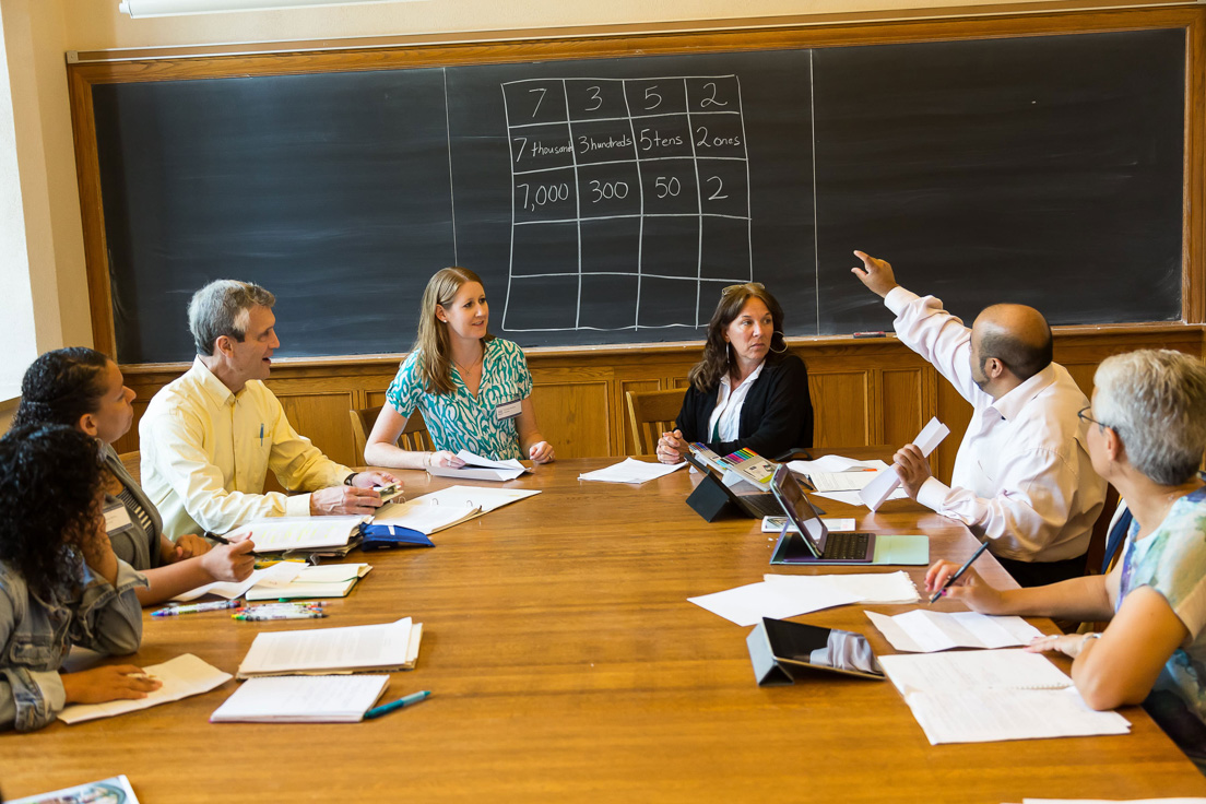 The national seminar on "Place Value, Fractions, and Algebra: Improving Content Learning through the Practice Standards," July 2014. (From left to right: National Fellow Marissa J. Brown, San José; seminar leader Roger E. Howe; National Fellows Torrieann M. Kennedy, Charlotte; Patricia Lee, Pittsburgh; Rajendra K. Jaini, Richmond; and Nancy Rudolph, New Castle County.)