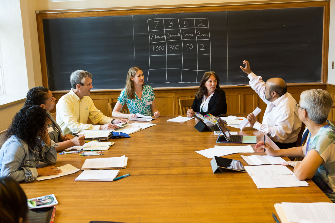 The national seminar on "Place Value, Fractions, and Algebra: Improving Content Learning through the Practice Standards," July 2014. (From left to right: National Fellow Marissa J. Brown, San José; seminar leader Roger E. Howe; National Fellows Torrieann M. Kennedy, Charlotte; Patricia Lee, Pittsburgh; Rajendra K. Jaini, Richmond; and Nancy Rudolph, New Castle County.)