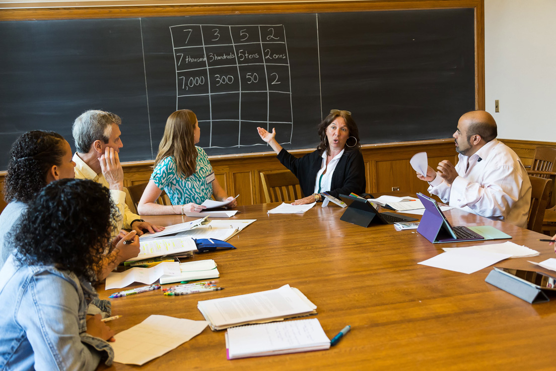 The national seminar on "Place Value, Fractions, and Algebra: Improving Content Learning through the Practice Standards," July 2014. (From left to right: National Fellow Marissa J. Brown, San José; seminar leader Roger E. Howe; National Fellows Torrieann M. Kennedy, Charlotte; Patricia Lee, Pittsburgh; and Rajendra K. Jaini, Richmond.)