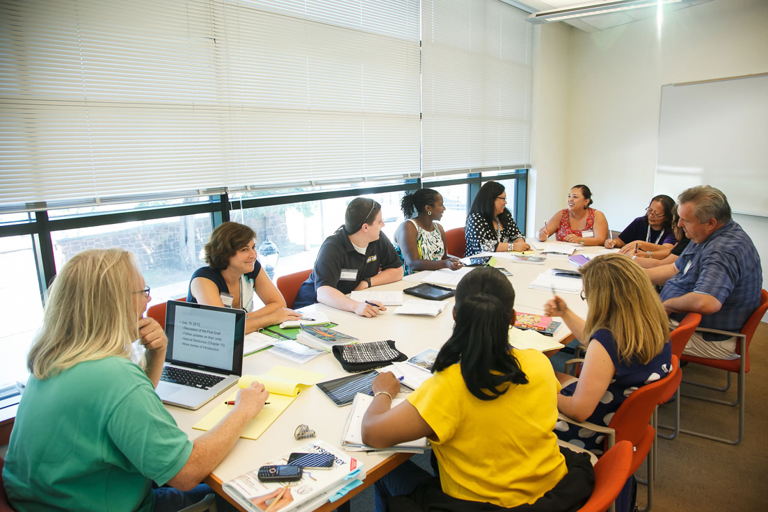 The national seminar on "How Drugs Work," July 2012. (Clockwise from left: seminar leader W. Mark Saltzman and National Fellows Valerie Schwarz, Stephen Lewia, Tracy Lewis, Marlene Gutierrez, Vanessa Vitug, Jolene Smith, Marilyn Dempsey, John Miklaszewski, Aimee MacSween, and Deborah Smithey.)