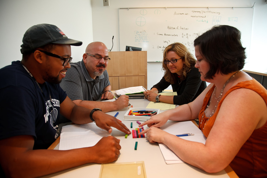 The national seminar on "Great Ideas of Primary Mathematics,"
July 2011. (Left to right: National Fellows Troy Holiday, Philadelphia;
Michael K. Pillsbury, Charlotte; Aimee MacSween, San Jos?; and
Emily B. Dentel, Tulsa.)