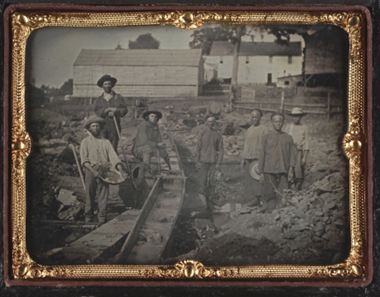 A Group of white and Chinese miners at a Sluice Box in Auburn Ravine